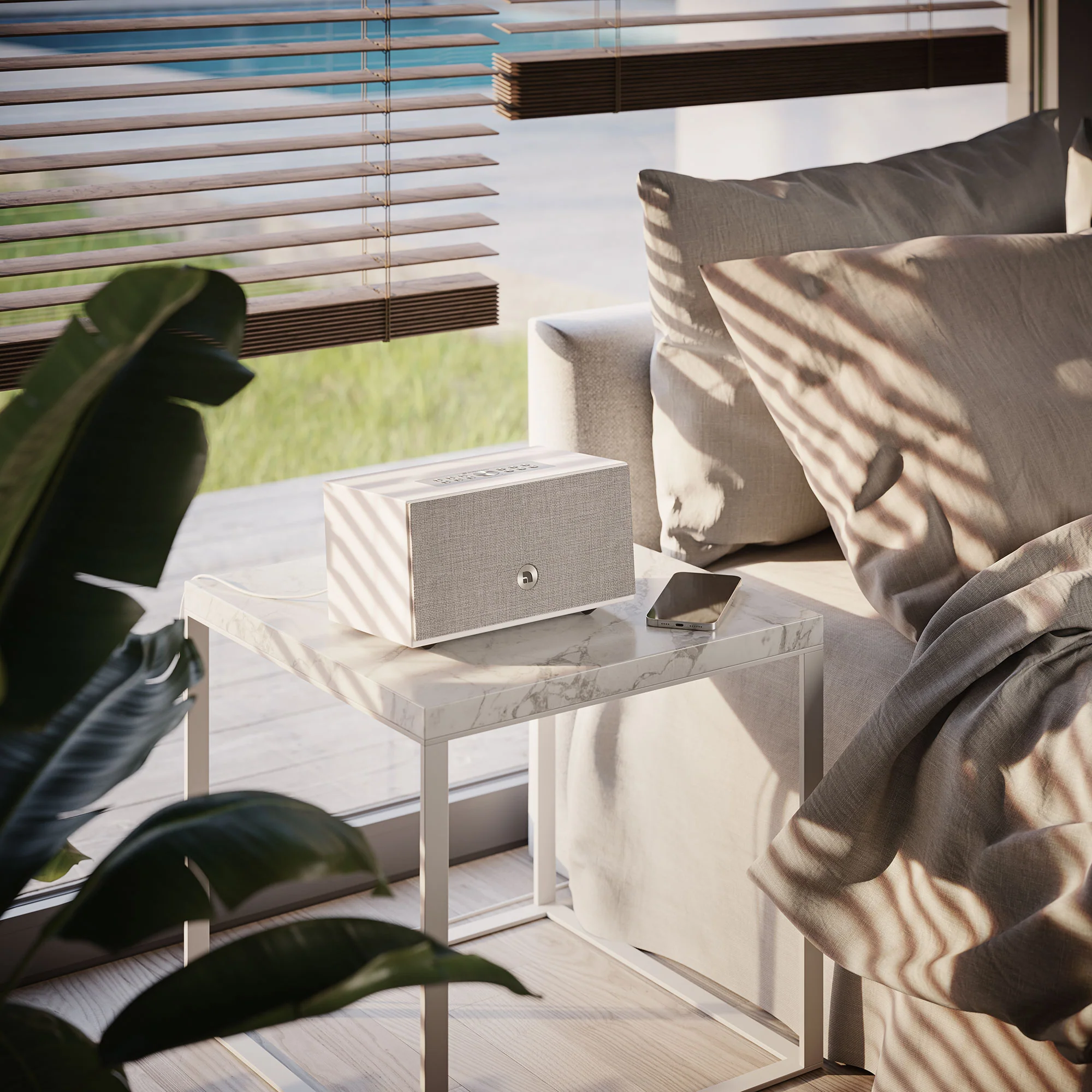 Audio Pro C5 MkII W smart speaker on bedside table