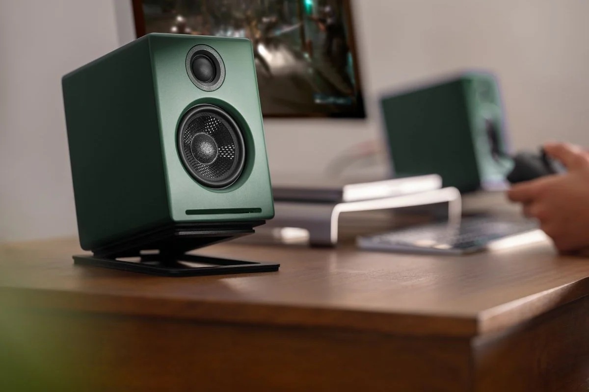 Active bookshelf speaker placed on a desk setup for nearfield listening and desktop audio systems.
